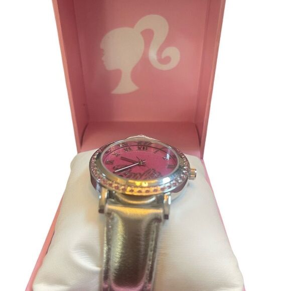 Barbie wrist watch with a metallic silver band adored with rhinestones. - Picture 2 of 4